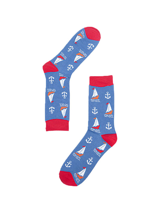 Mens blue and red bamboo socks lying flat. They are patterned with sail boats and anchors.