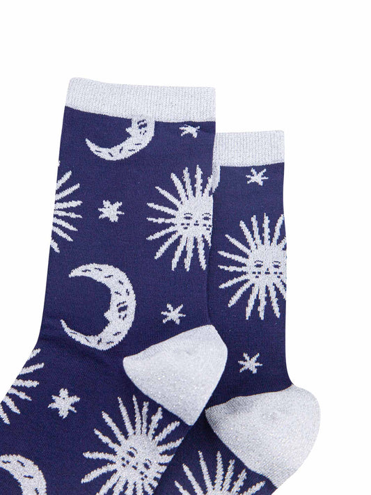 close up, showing the silver glitter heel, toe, cuff and sparkles on the celestial patterns