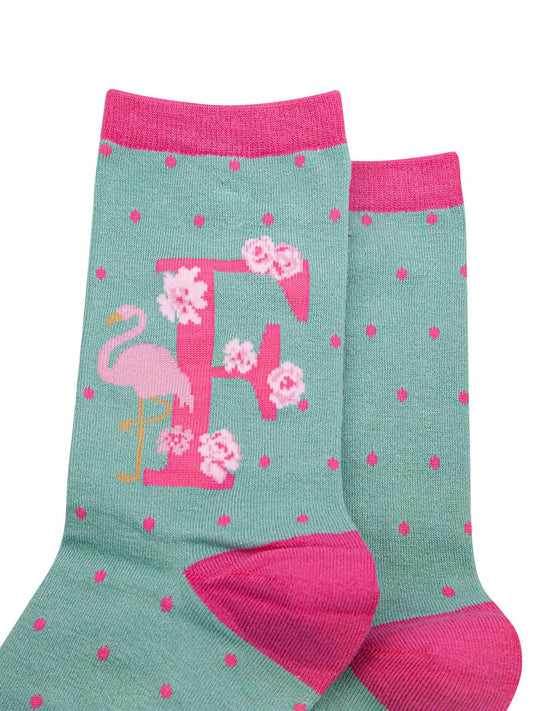 green, pink bamboo socks with the initial F