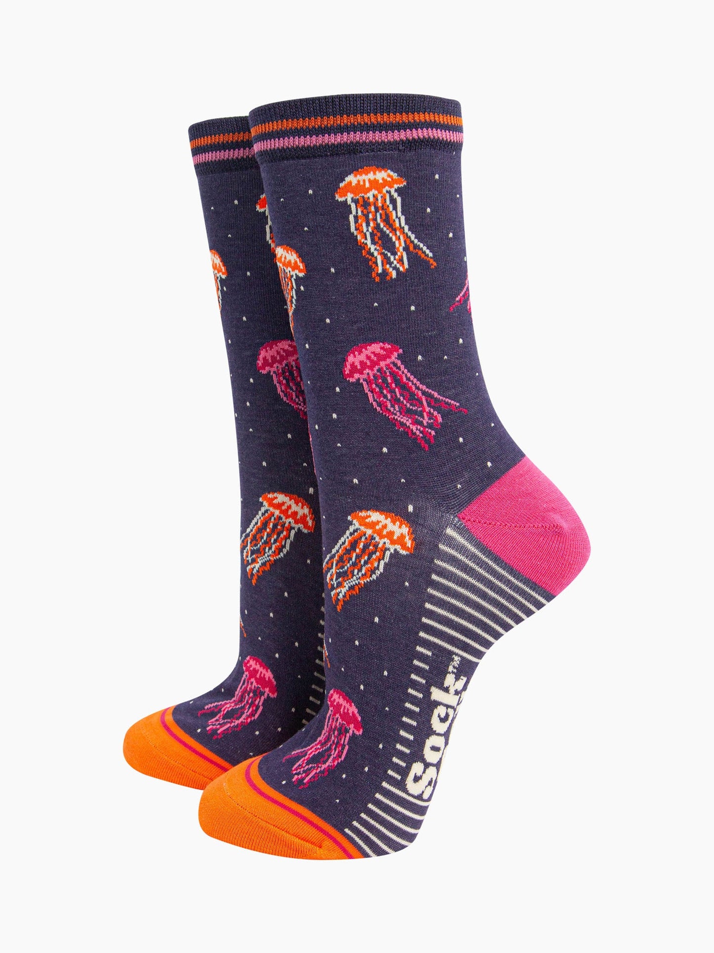 womens-bamboo-socks-navy-jellyfish-showing-the-pattern-of-pink-and-orange-floating-jellyfish-covering-the-design