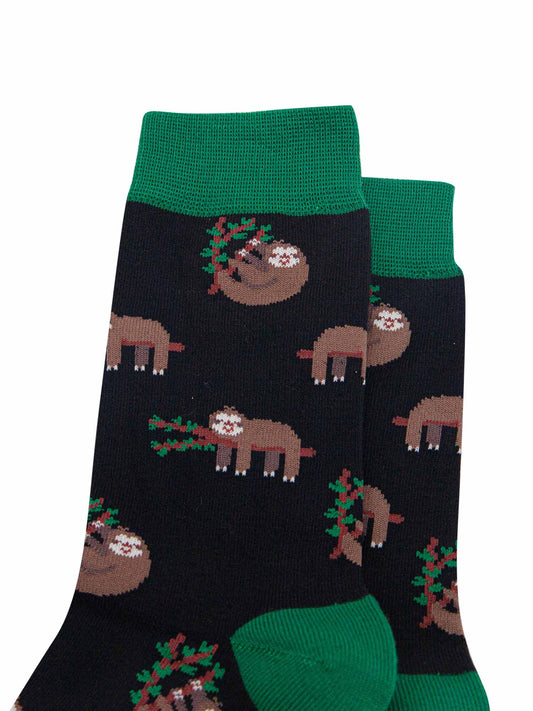 mens black and green bamboo socks with an all over pattern of sleeping sloths