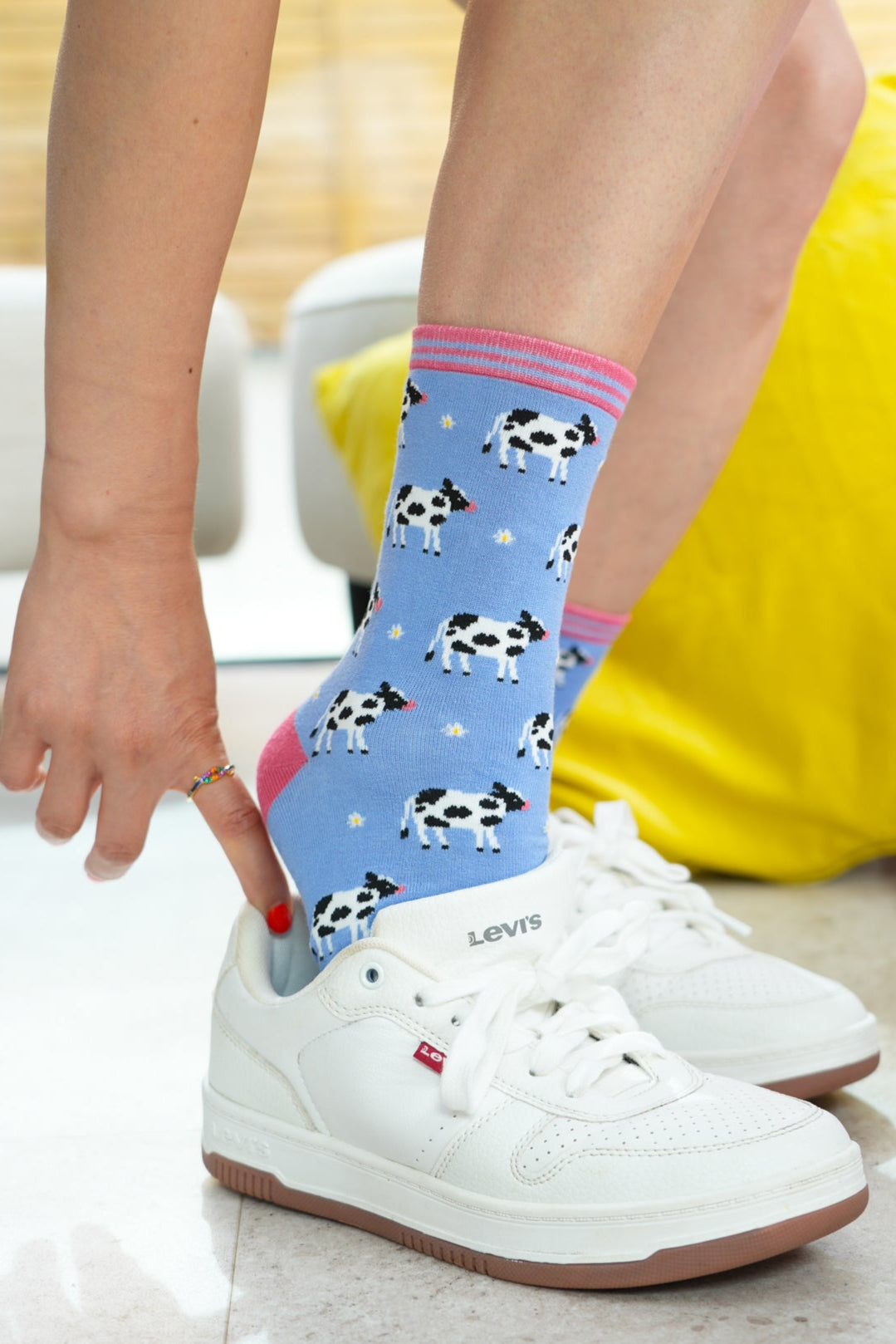 womens-spring-cow-print-bamboo-socks-styled-with-white-trainers