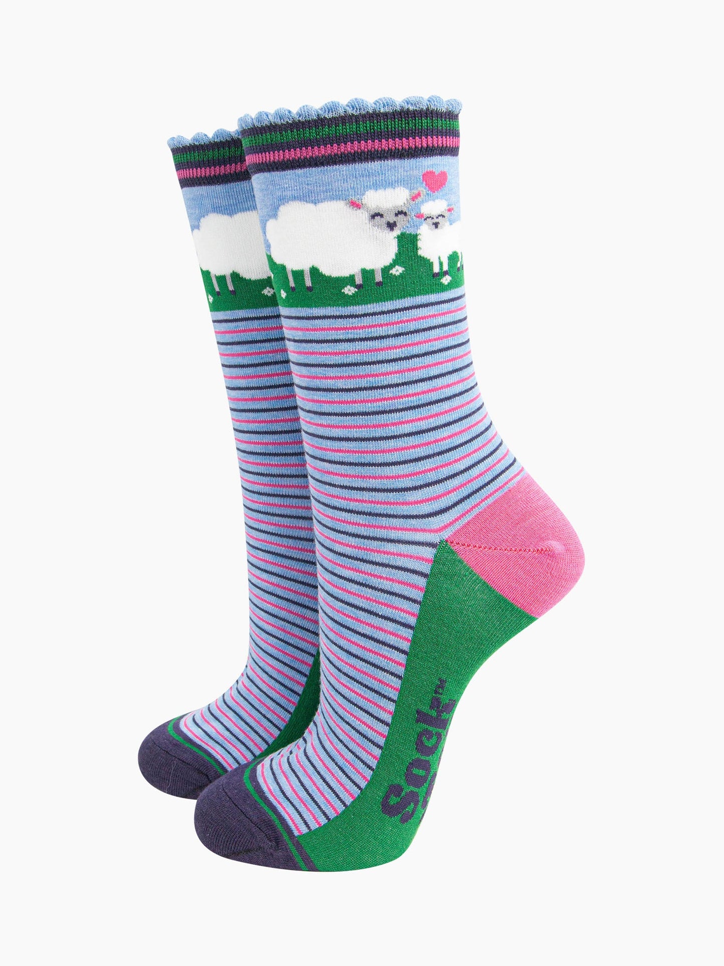 women's bamboo socks sheep and lamb. blue socks with pink and blue alternating horizontal pin stripes. the ankle features a mother sheep and baby lamb and a pink love heart.