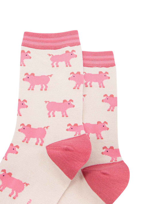 showing the cream and pink ladies pig socks laying flat, the pig pattern is all over the socks