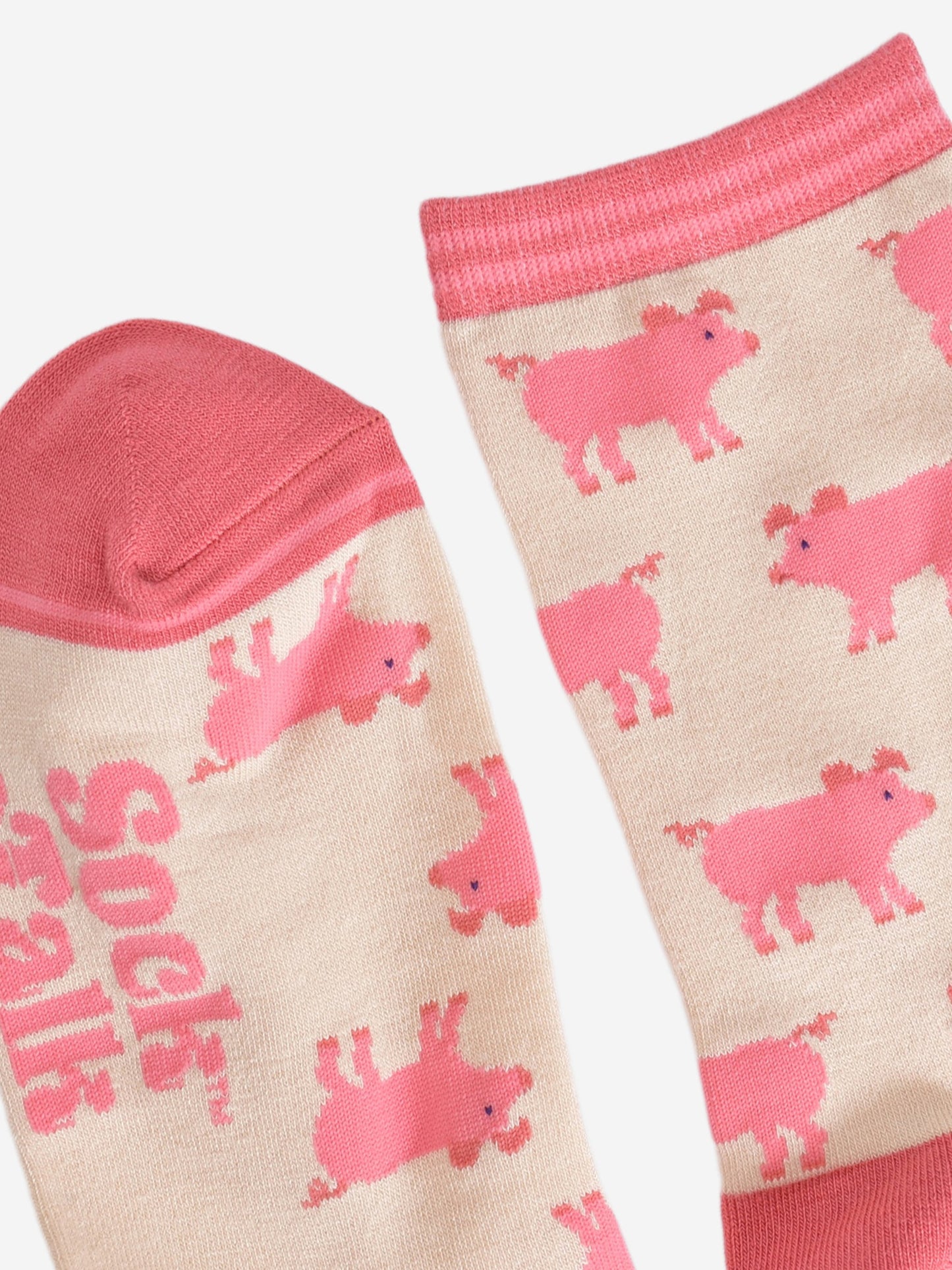 close up of the pink toe and cuff on the cream pig bamboo socks