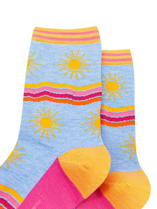 womens-bamboo-socks-blue-sunshine-wavy-stripes-close-up-large-yellow-suns-rainbow-wavy-stripes-in-yellow-pink-fuchsia-orange