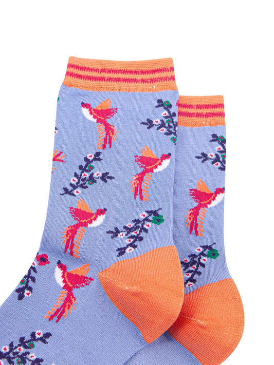 close up of the pink hummingbird print on the bamboo ankle socks, a close up of the orange and pink stiped cuff