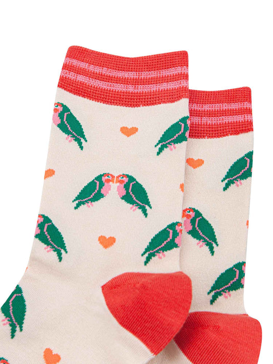 close up of the green love bird patten and pink love hearts on these bamboo ankle socks
