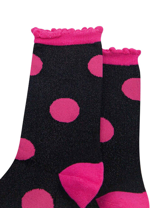 close up of the pink and black glitter socks showing the all over sparkle effect of the material