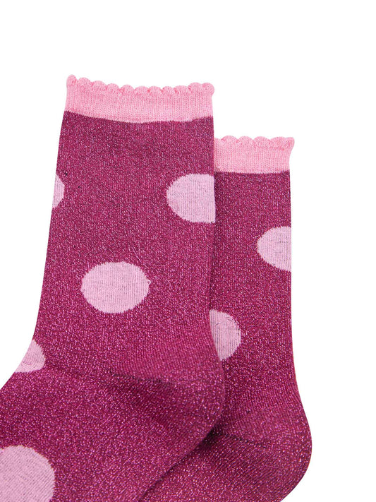 close up of the silver glitter sparkle of the ankle socks, also showing clearly the scalloped cuff