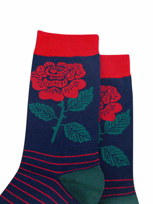 close up of the traditional red english rose on the ankle of the mens dress socks