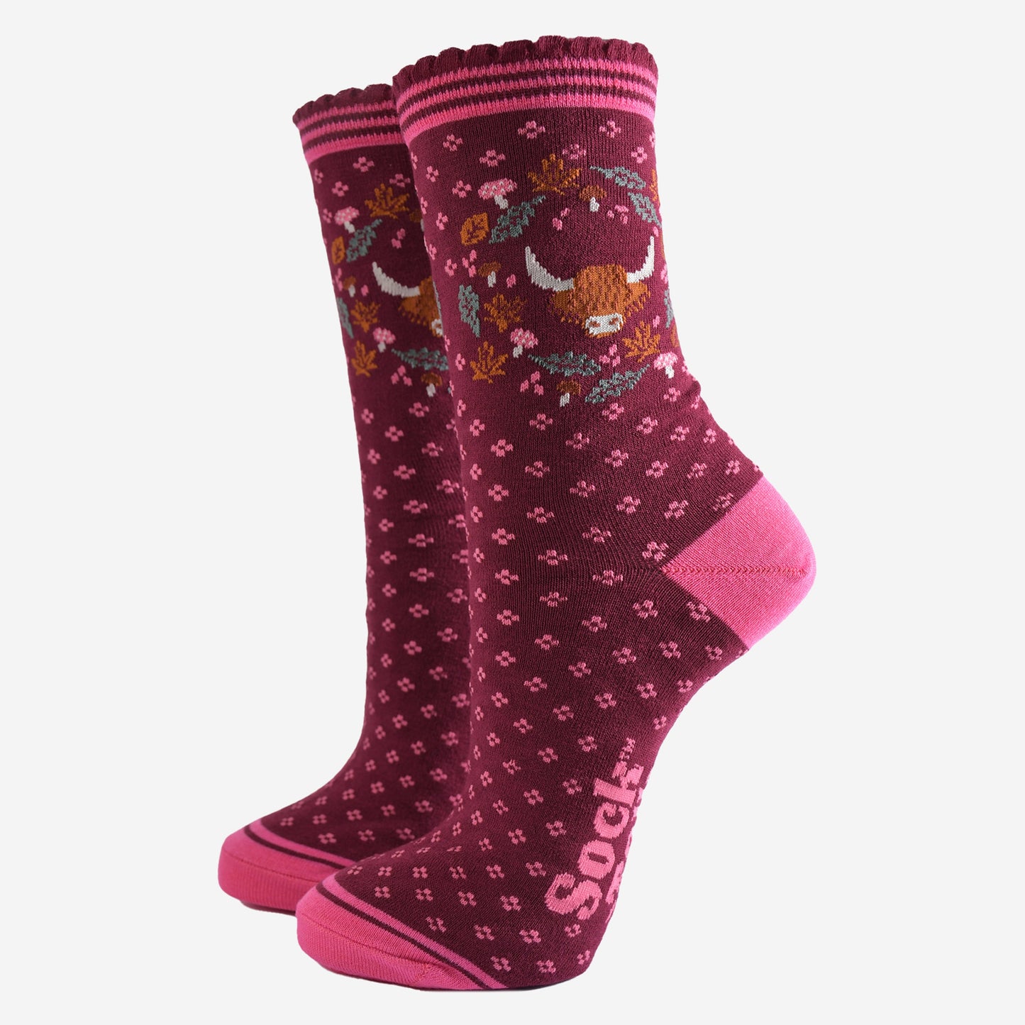 burgundy ankle socks with scalloped cuffs featuring a highland cow and a wreath featuring autumn leaves and woodland toadstools