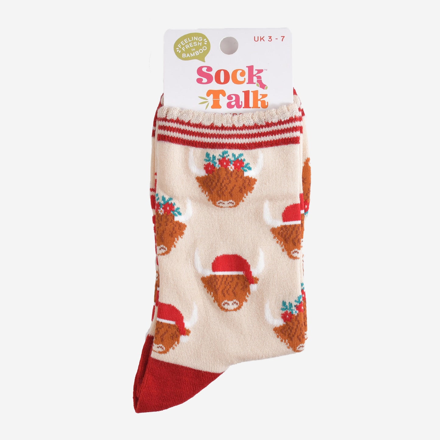 festive highland cow bamboo socks in their sock talk packaging, these socks are a uk size 3-7