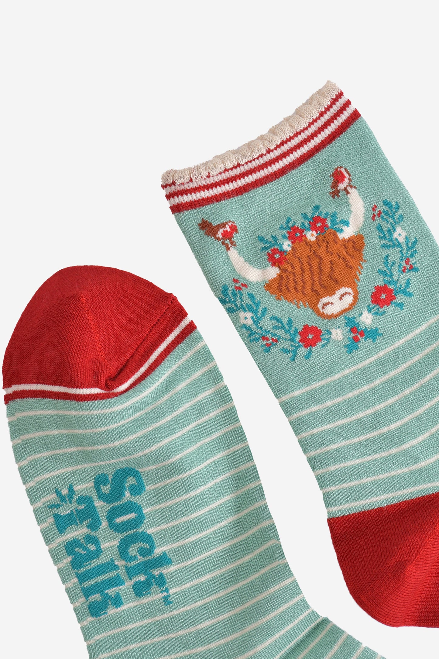 close up of the toe and cuff of the bamboo socks, the toe is red and the cuff is scalloped with red and cream stripes