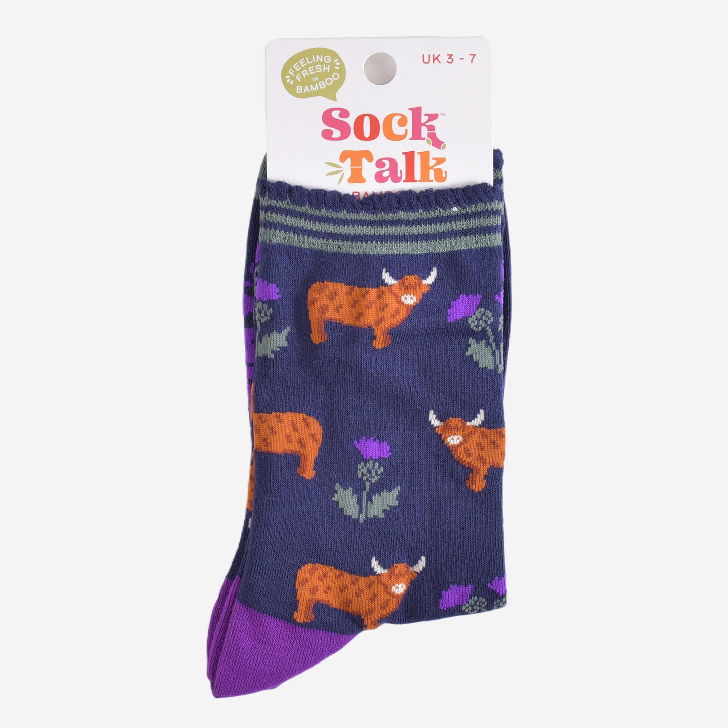 highland cow thistle bamboo socks in their sock talk packaging, the socks are a uk size 3-7