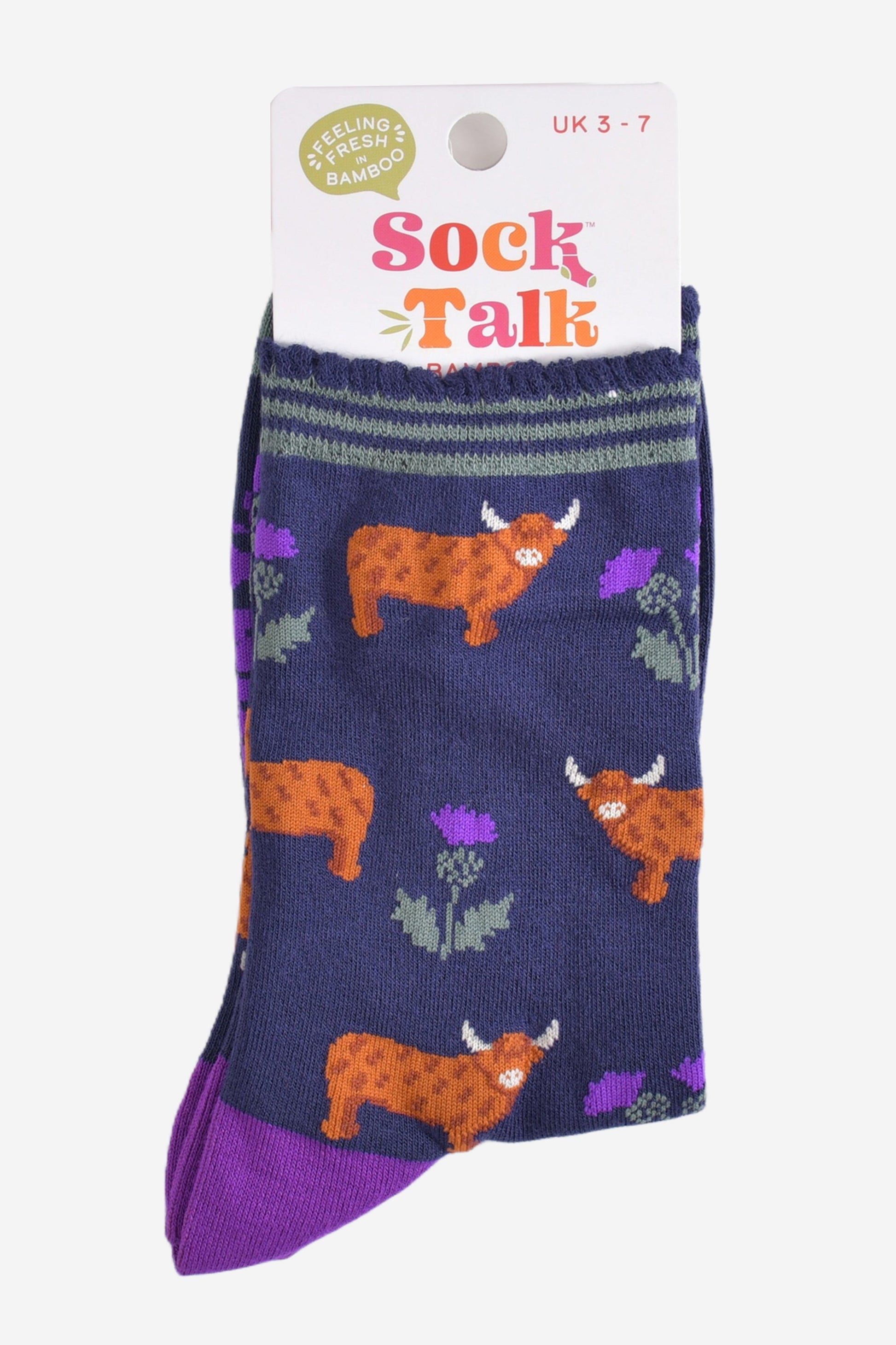 highland cow thistle bamboo socks in their sock talk packaging, the socks are a uk size 3-7