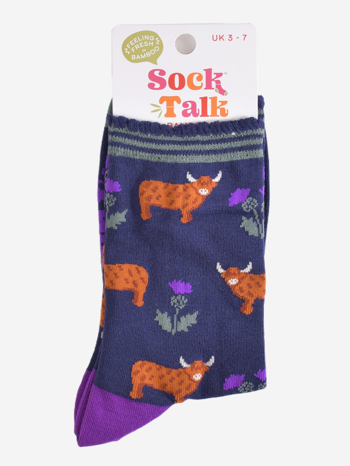 highland cow thistle bamboo socks in their sock talk packaging, the socks are a uk size 3-7