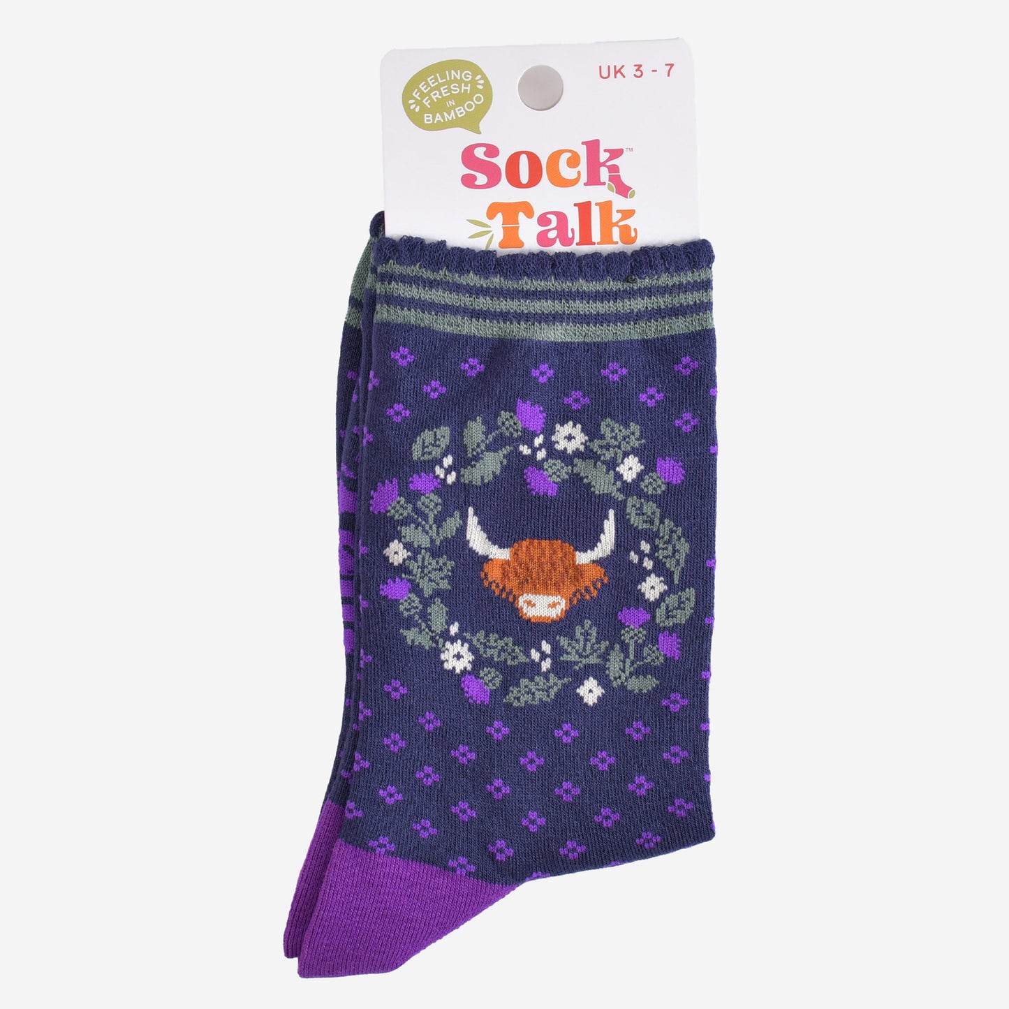 highland cow thistle wreath bamboo socks in their sock talk packaging, the socks are a uk size 3-7