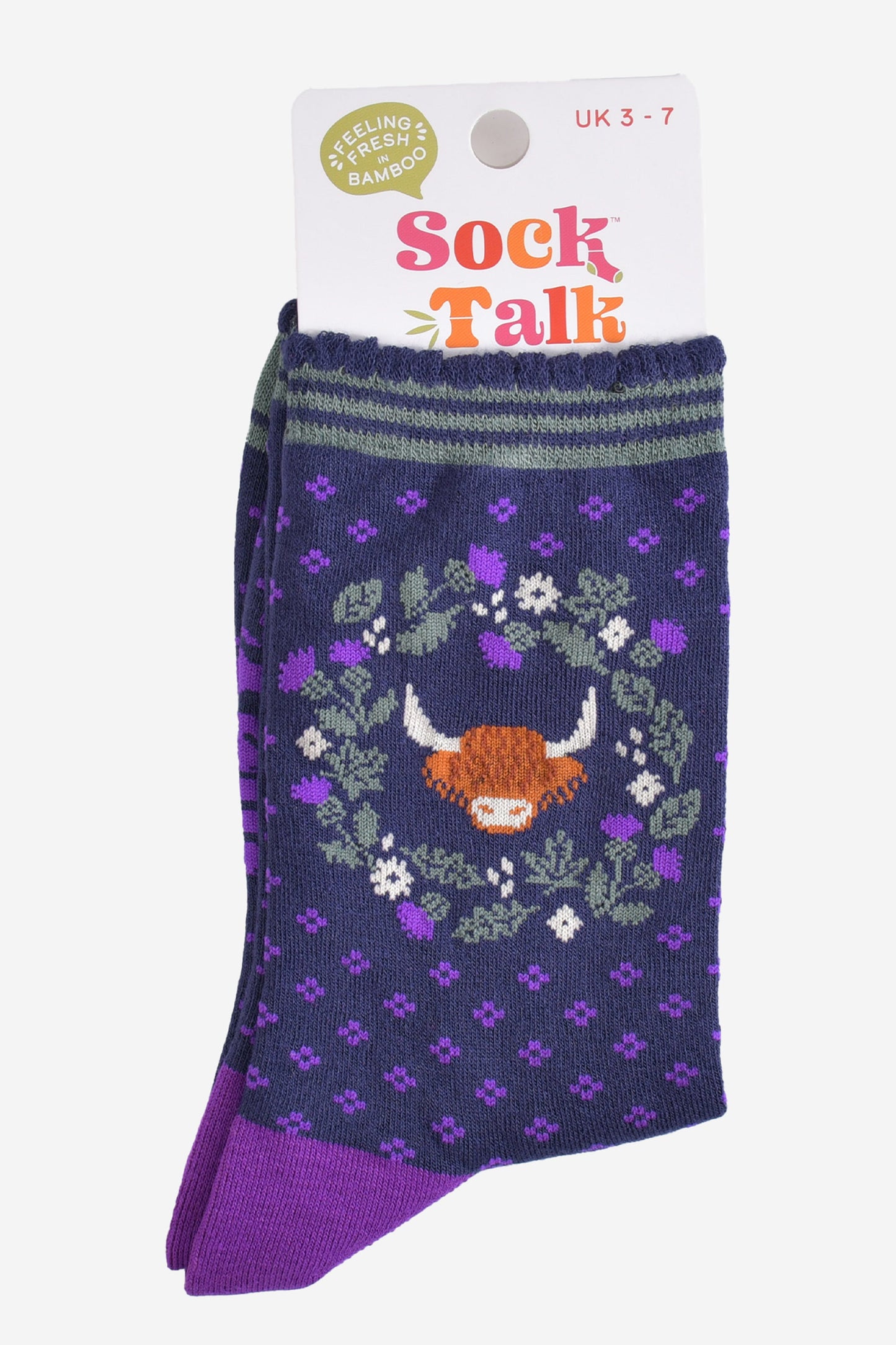 highland cow thistle wreath bamboo socks in their sock talk packaging, the socks are a uk size 3-7