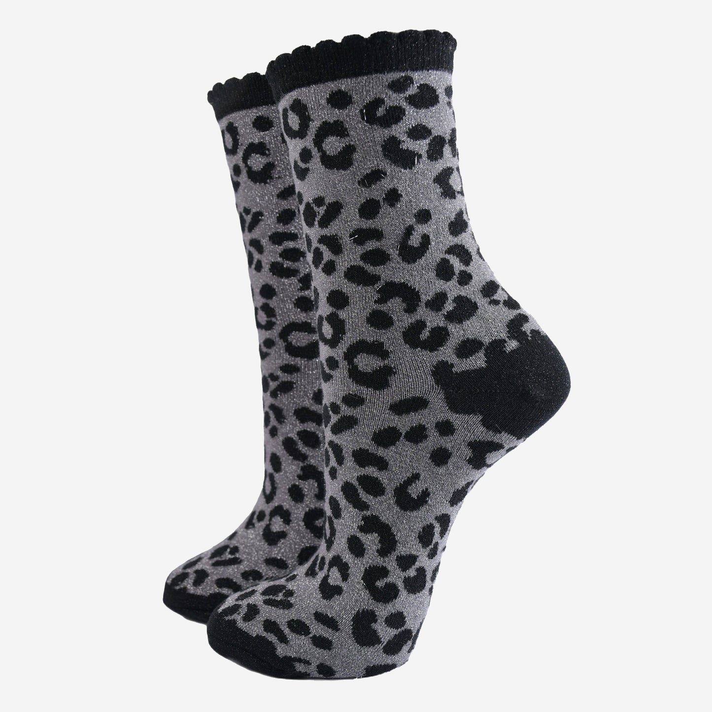 grey ankle socks with a black leopard print pattern, all over glitter sparkle and black scalloped cuff