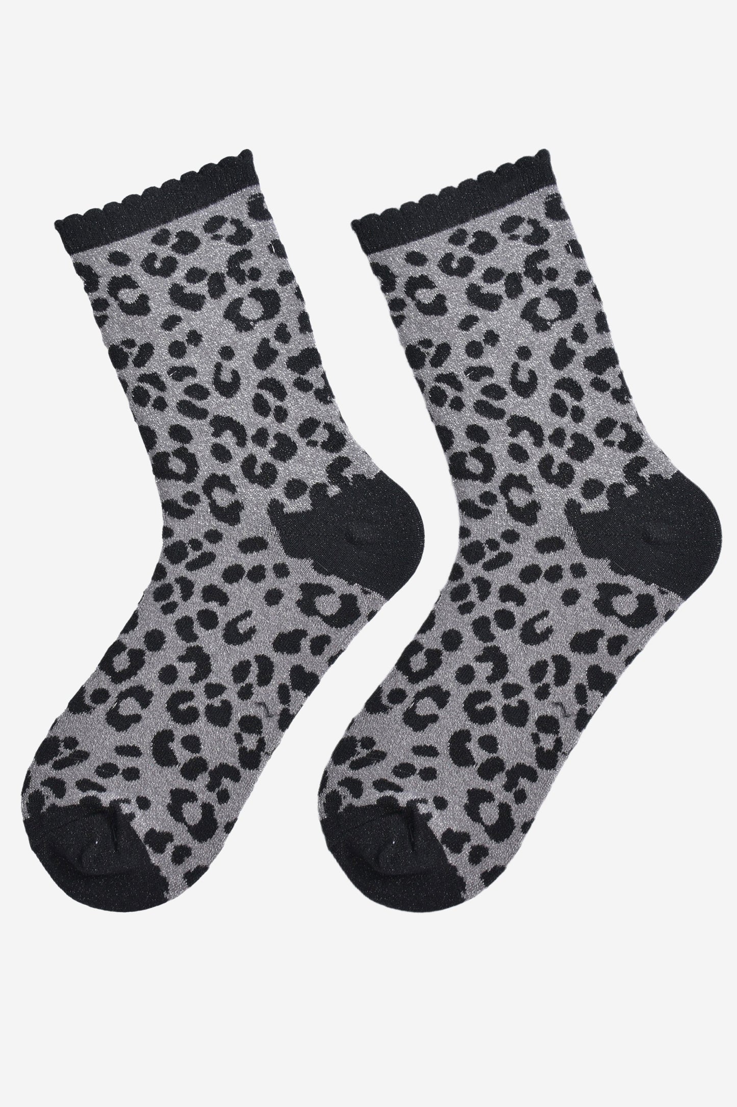 showing the grey and black leopard print glitter socks laying flat, the all over glitter sparkle is visible