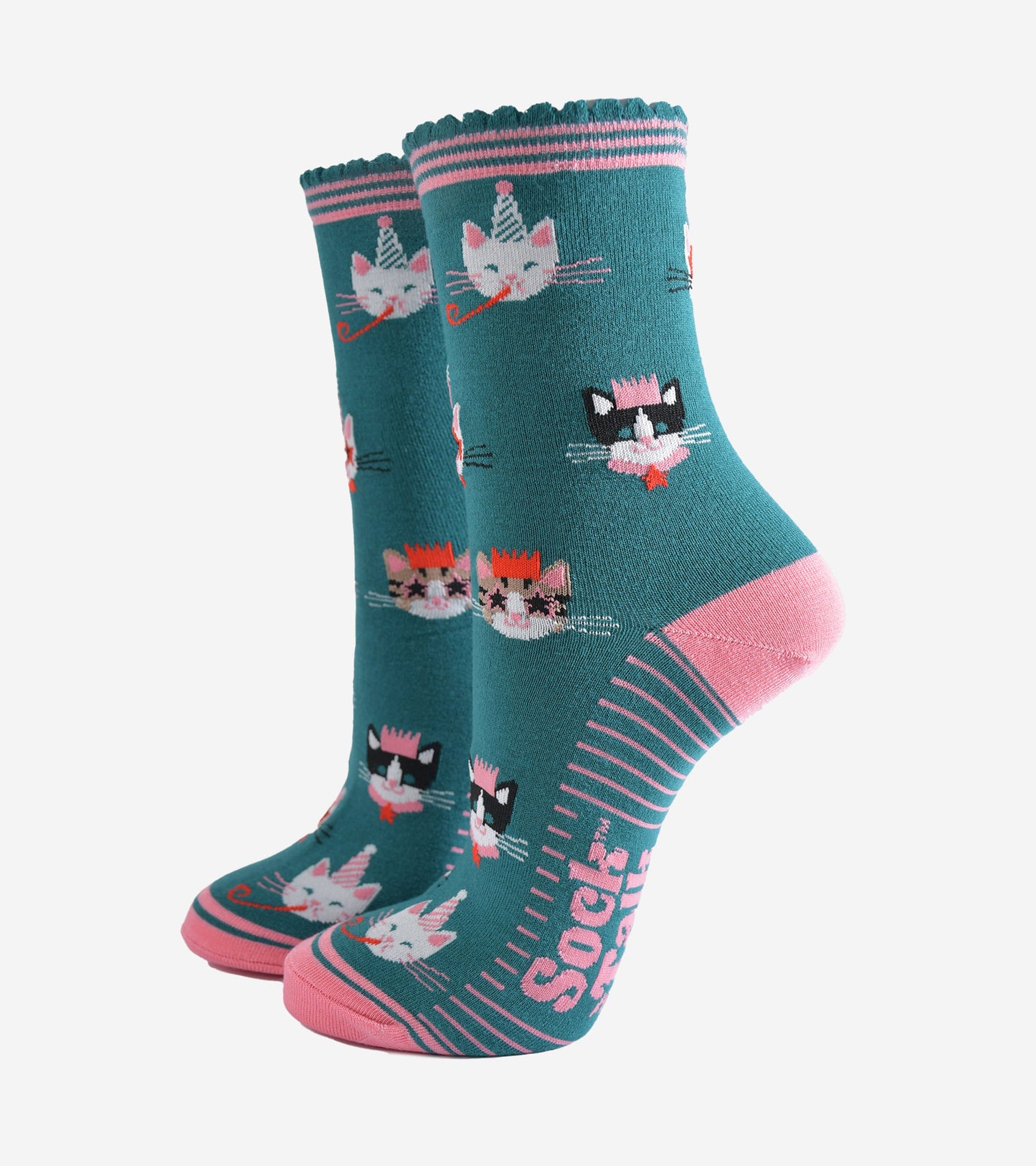 teal green socks with pink heel, toe and striped cuff with an all over pattern featuring cats wearing party hats