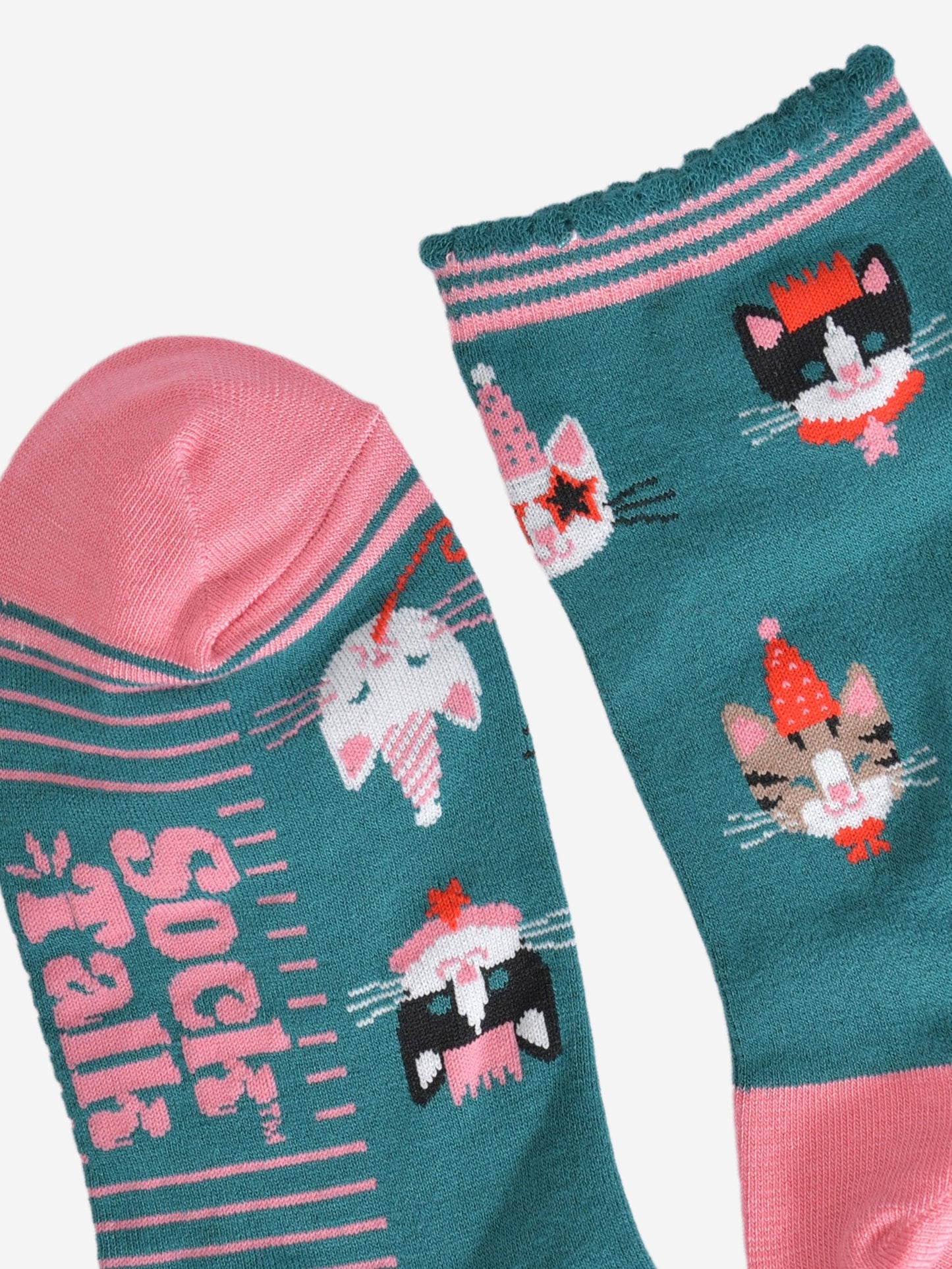 close up of the toe and cuff, the toe is pink and the cuff is scalloped with green and pink stripes