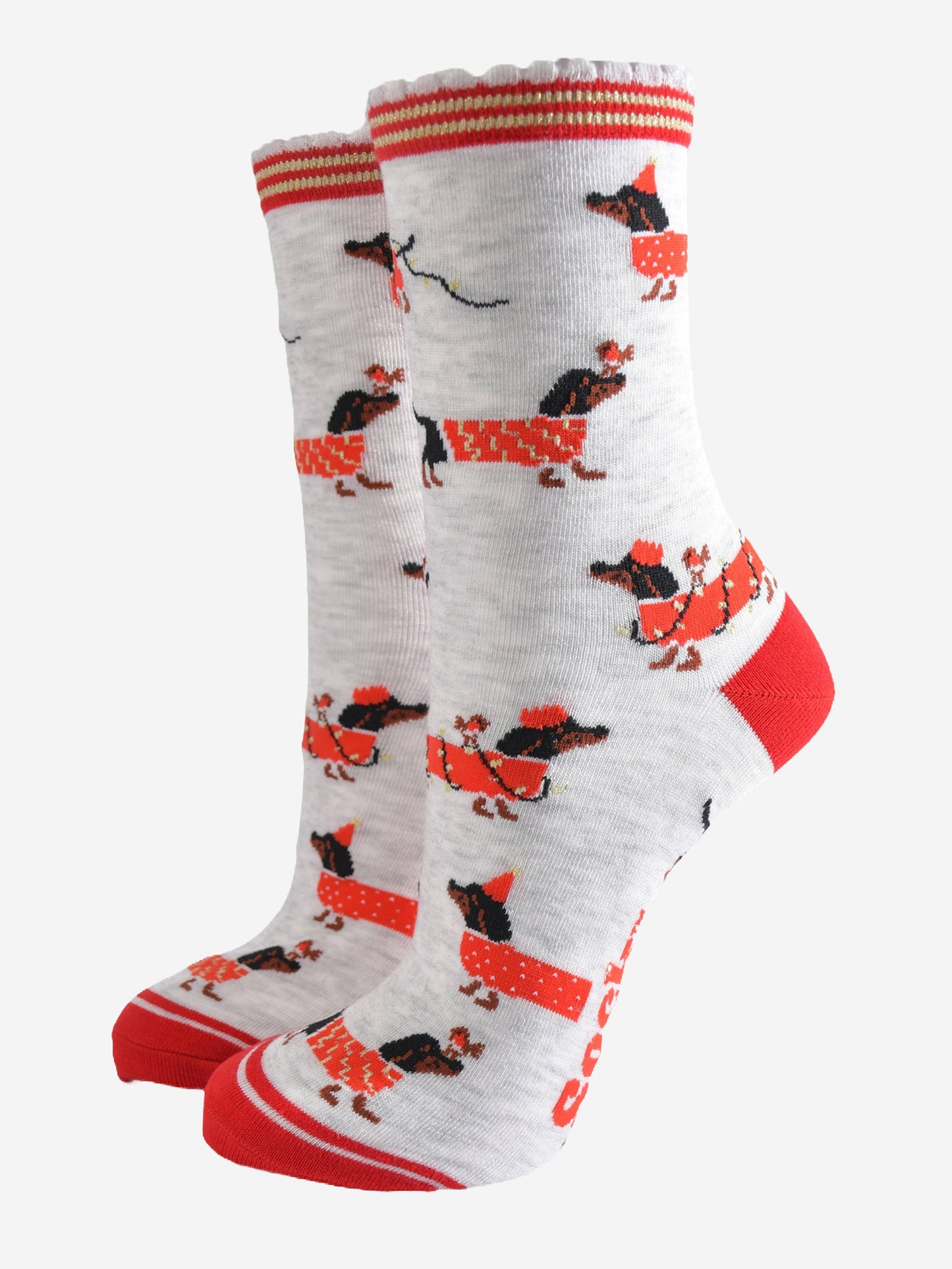 light grey socks with a red heel, toe and cuff with a pattern of dachshunds wearing xmas lights, jumpers and playing with red robin birds