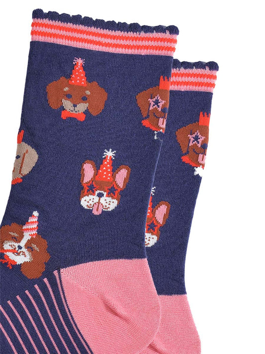 navy blue and pink ankle socks with a pattern of dogs wearing party hats and novelty glasses