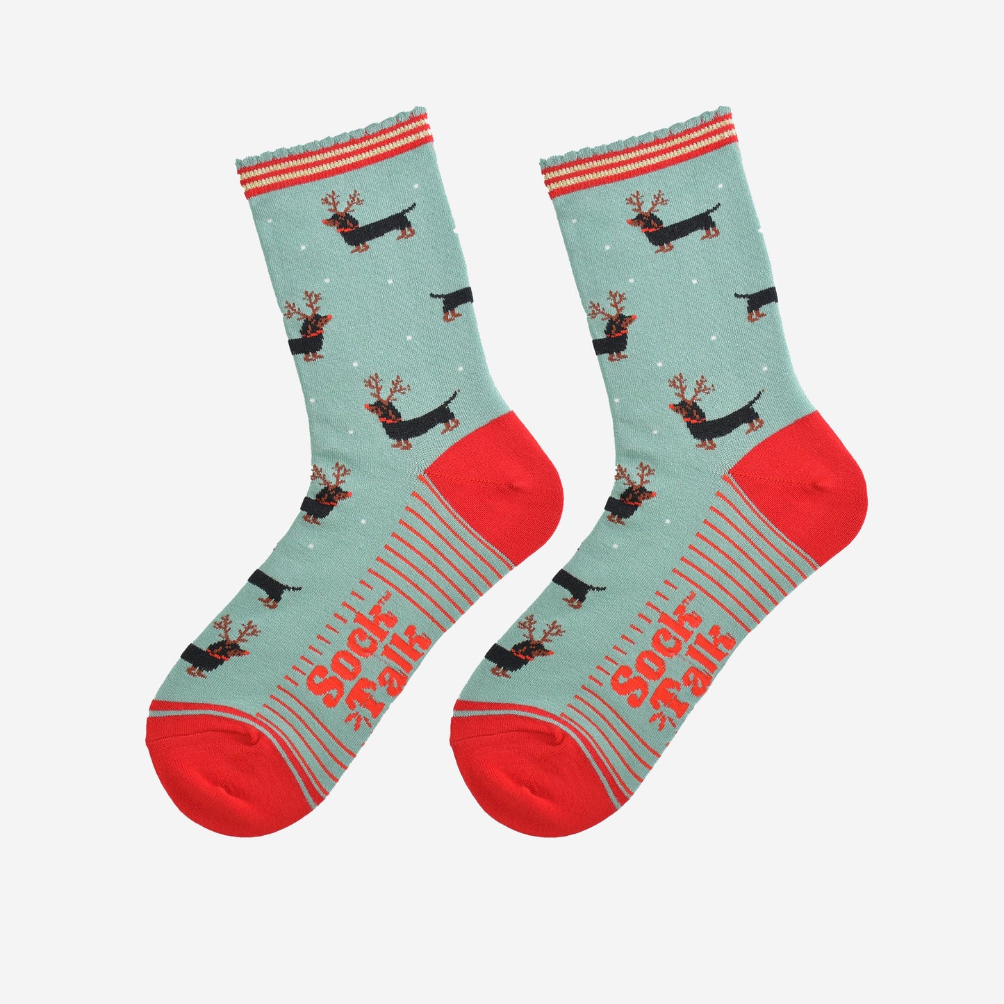 showing the sausage dog reindeer socks laying flat, the soles have red stripes and the dachshund dog pattern is shown to repeat all over the design.