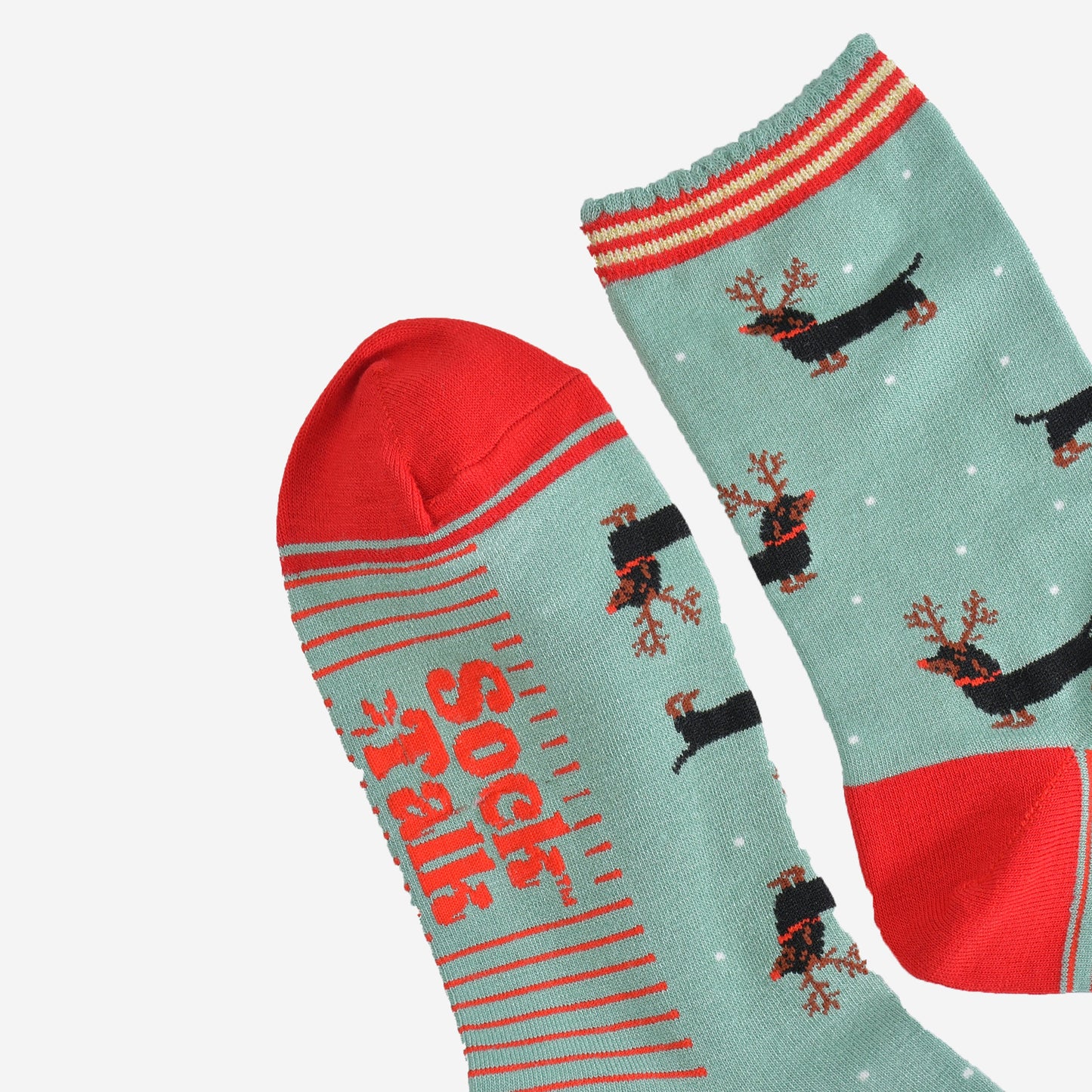 close up of the toe and cuff, the toe is red with a green border stripe, the cuff has a scalloped edge and has red and gold stripes