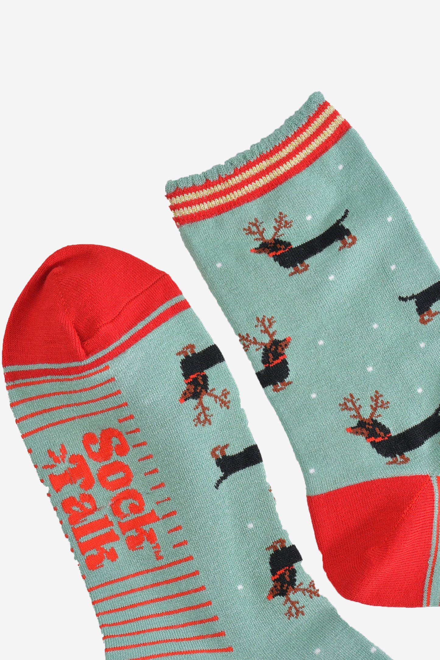 close up of the toe and cuff, the toe is red with a green border stripe, the cuff has a scalloped edge and has red and gold stripes