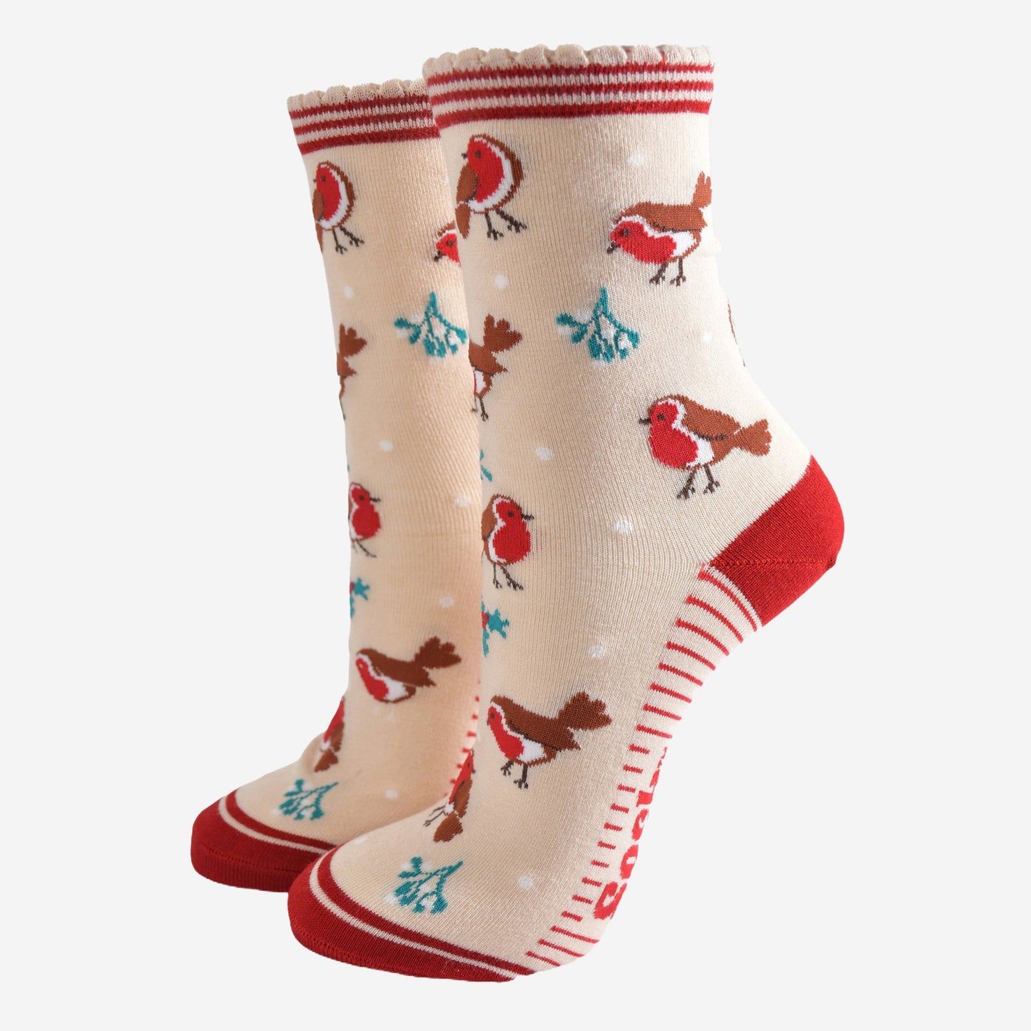 cream socks with a red striped cuff with a pattern of red robin birds, mistletoe and holly all over