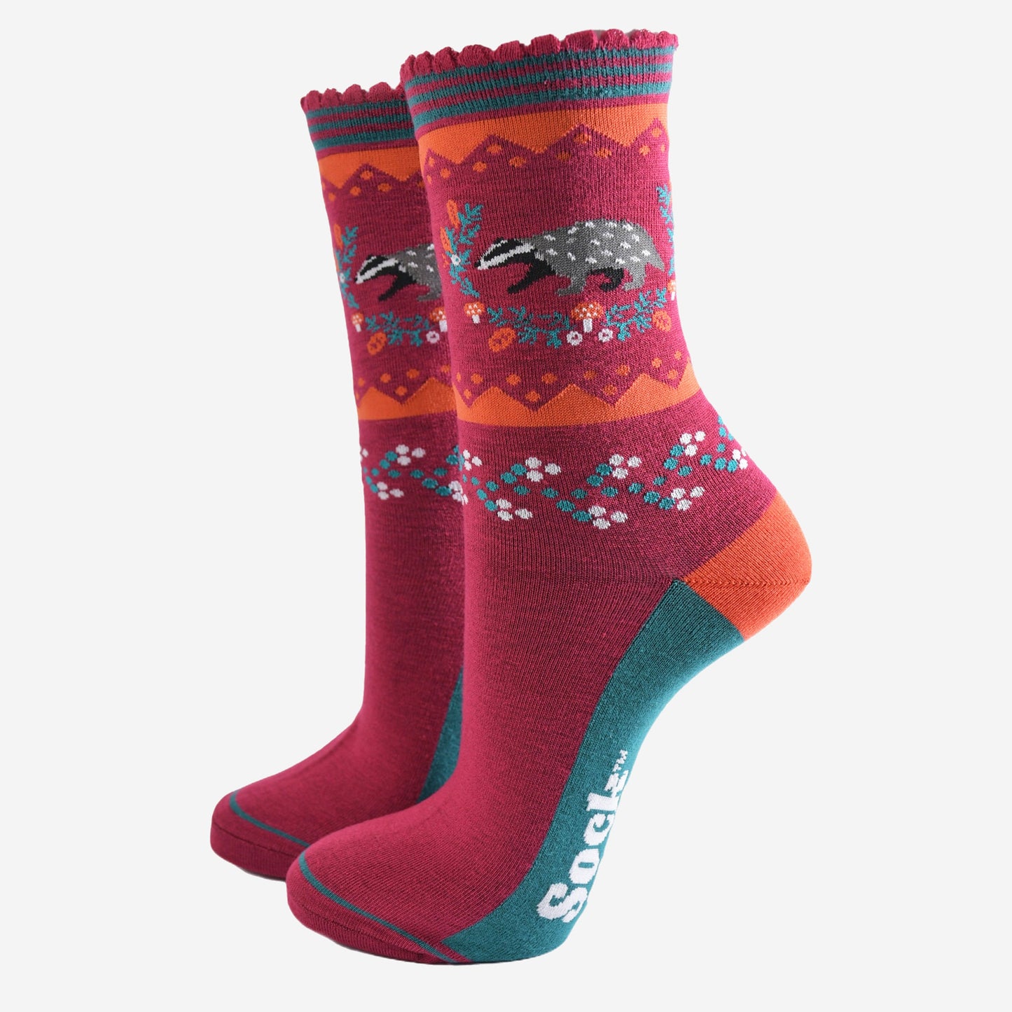 berry red socks with a woodland badger and autumnal floral wreath motif on the ankle