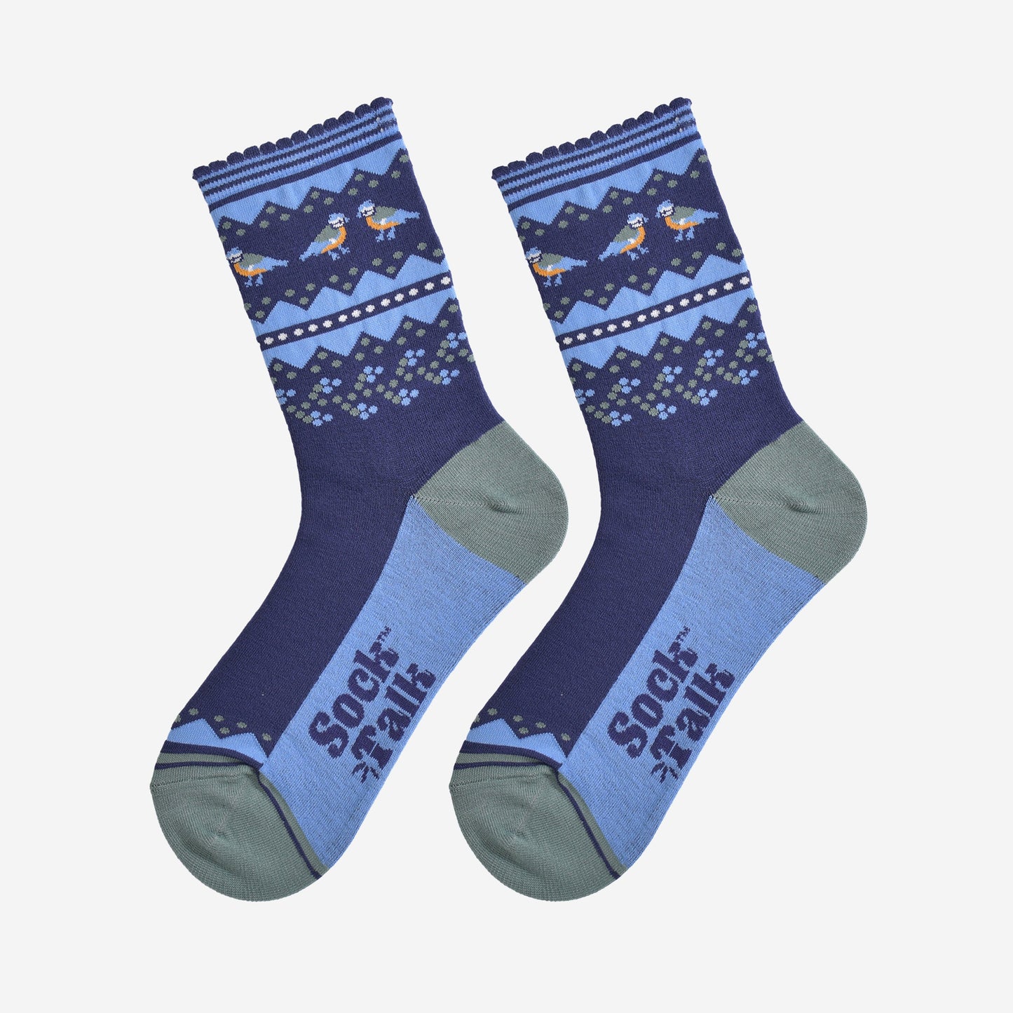 blue tit fair isle socks laying flat, showing the contrasting dark and light blue socks, with a decorative fair isle pattern around the ankles featuring blue tit garden birds