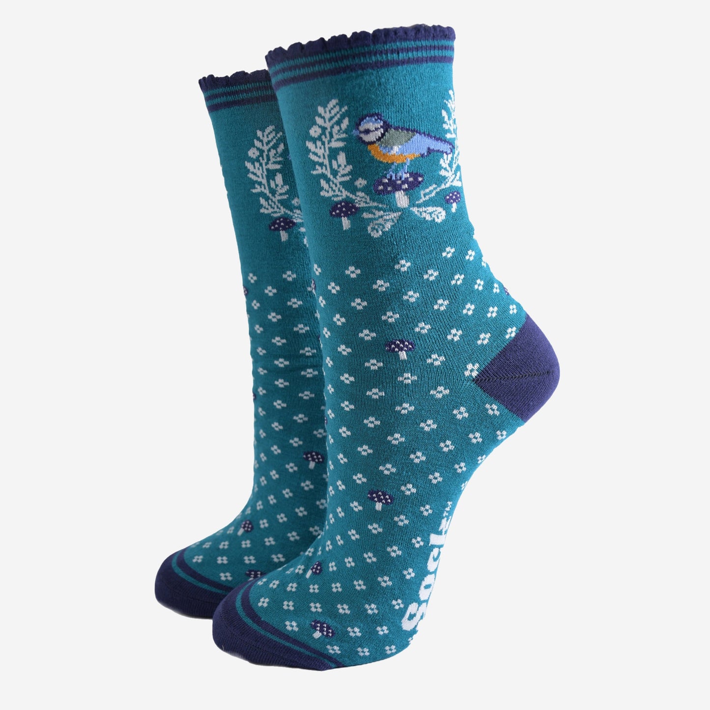 teal blue ankle socks with a navy scalloped cuff with a pattern of blue tit birds, floral wreath and blue toadstools