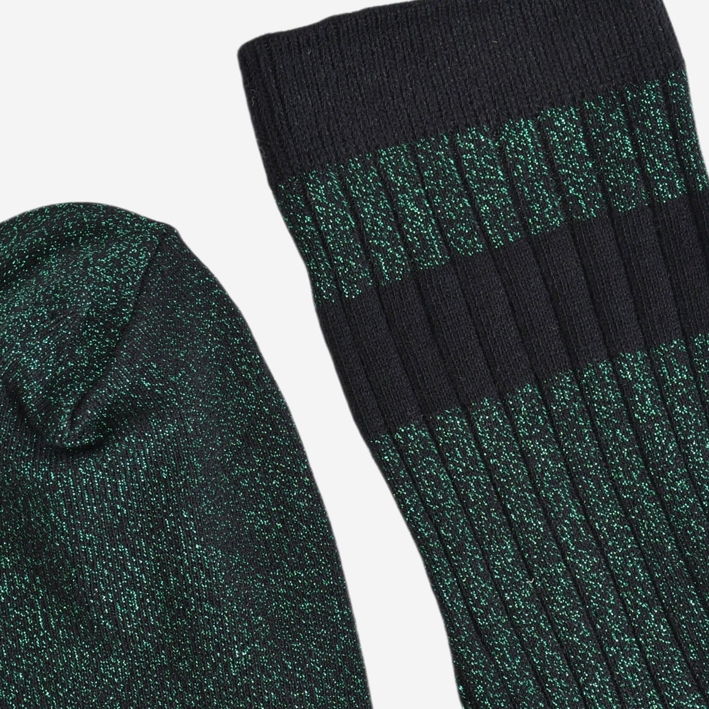 close up of the toe and cuff. the toe is green with silver glitter the same as the base of the socks. the cuff is black and without glitter.
