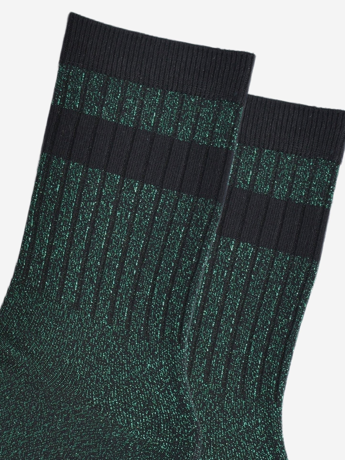 close up of the ribbed sports style cuffs on the socks. they have vertical ribbed details. the base of the socks are green with a silver glitter sparkle. the cuff is black and there is a horizontal black band stripe, without glitter an inch below the cuff.