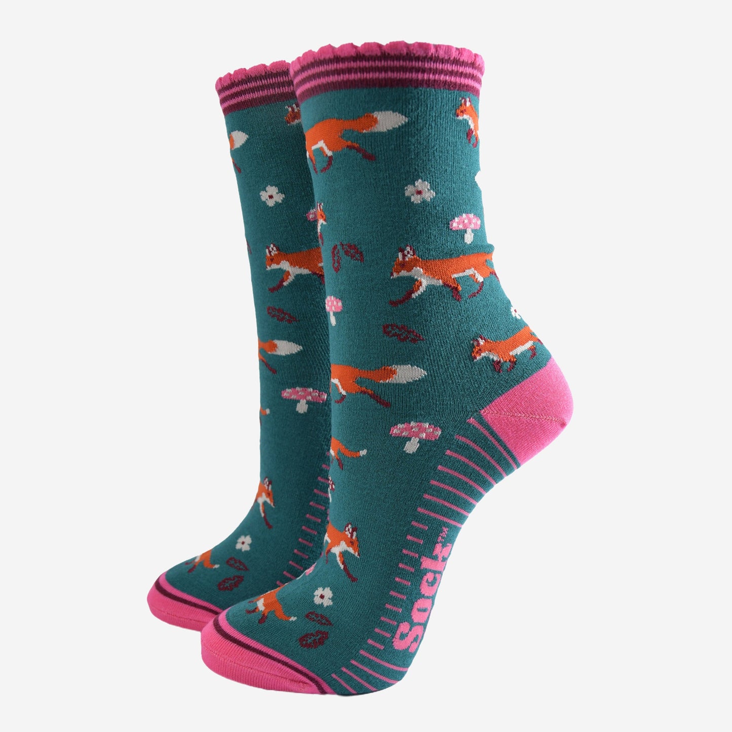 green socks with pink accents and an all over pattern featuring red foxes and toadstools