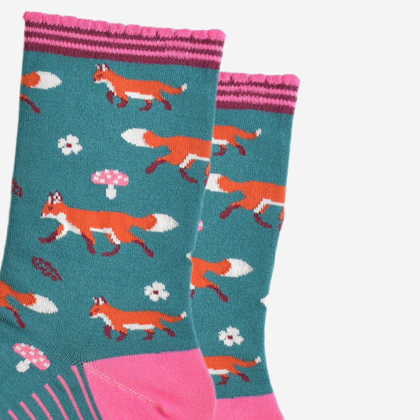 close up of the fox, toadstool and floral pattern on the socks