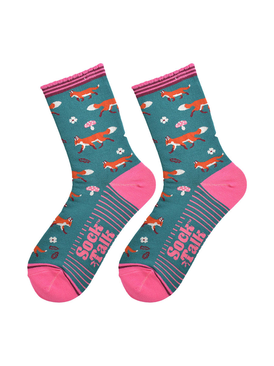 red fox woodland socks laying flat, showing the all over fox, leaf and toad stool pattern and pink accents