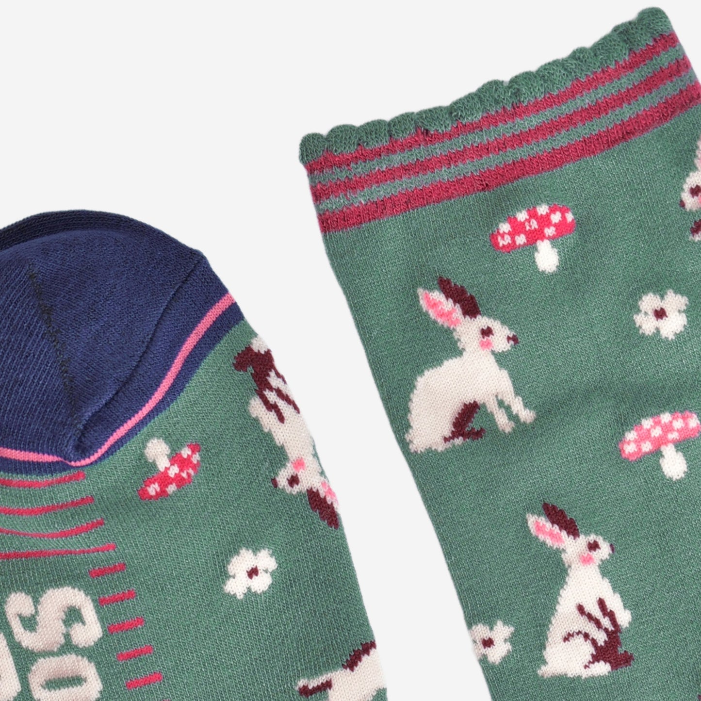 close up of the toe and cuff, the toe is navy blue with a pink border stripe, the cuff is green and scalloped with pink stripes