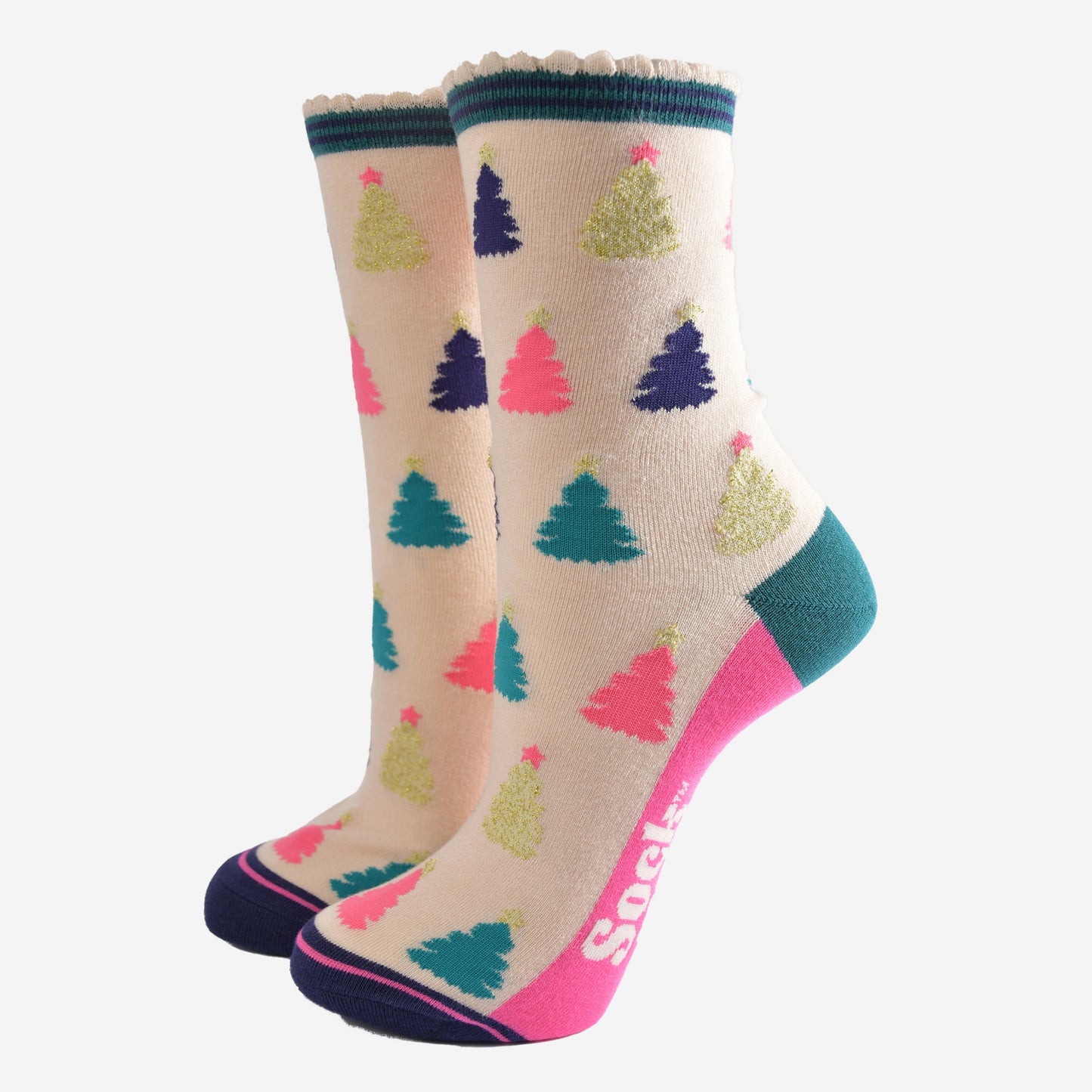 cream bamboo socks with a multicoloured christmas tree pattern all over, the trees are pink, gold, green and navy blue