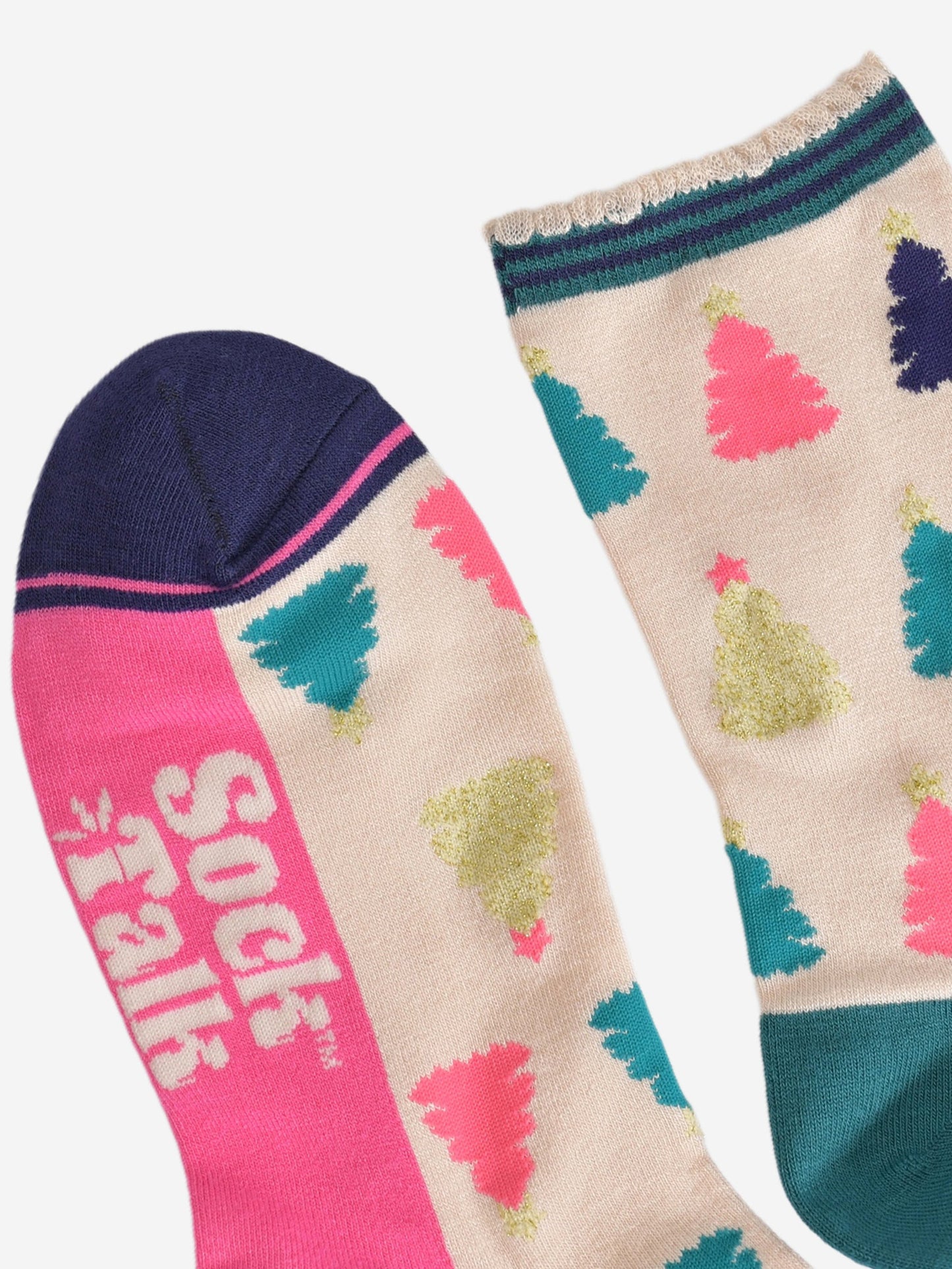 close up of the toe and cuff, the toe is navy blue with a hot pink border stripe, the cuff is scalloped and is cream with a navy and green striped trim