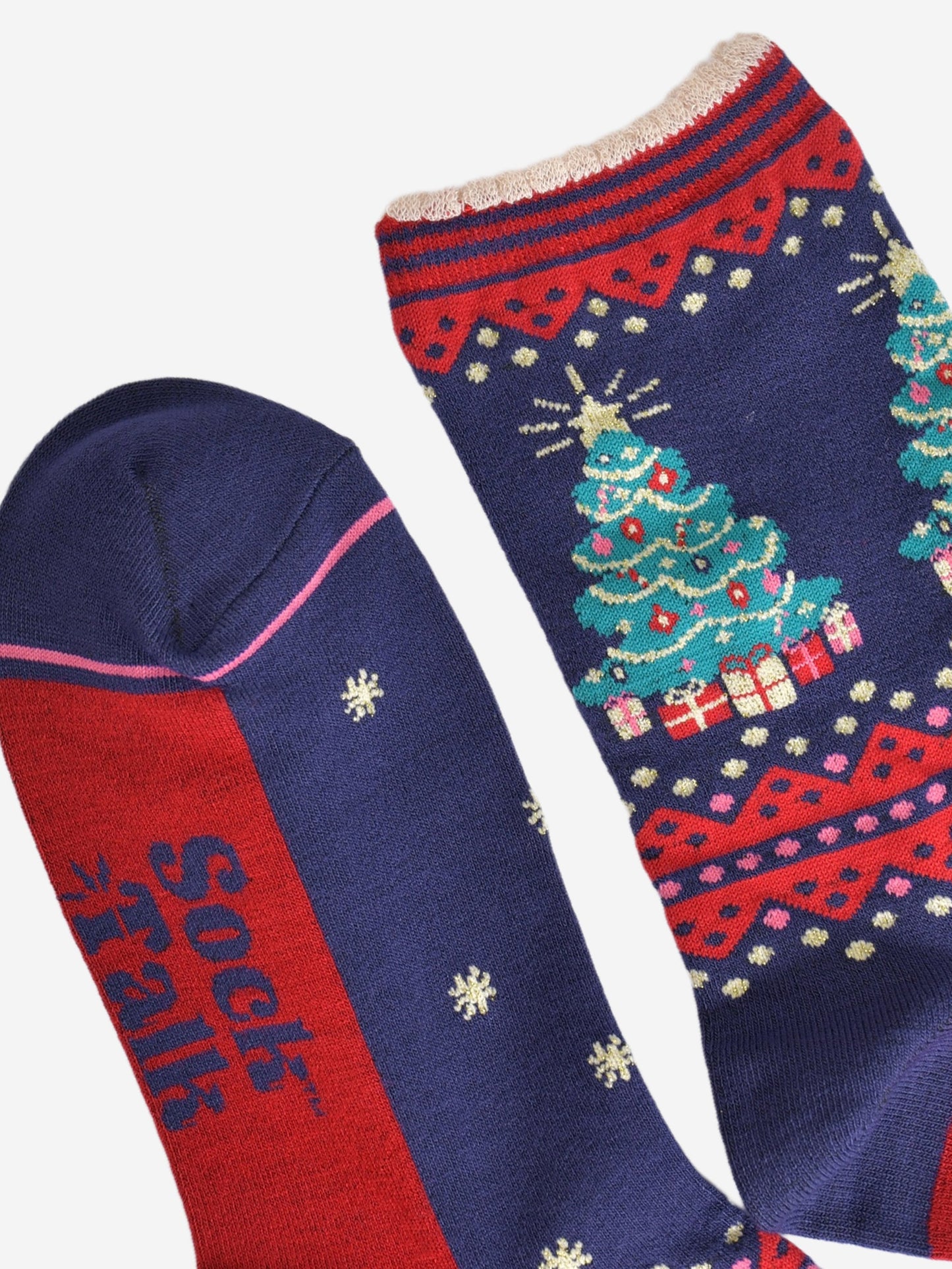 close up of the toe and cuff, the toe is navy blue a hot pink contrasting border stripe, the cuffs are scalloped and are red and navy blue striped