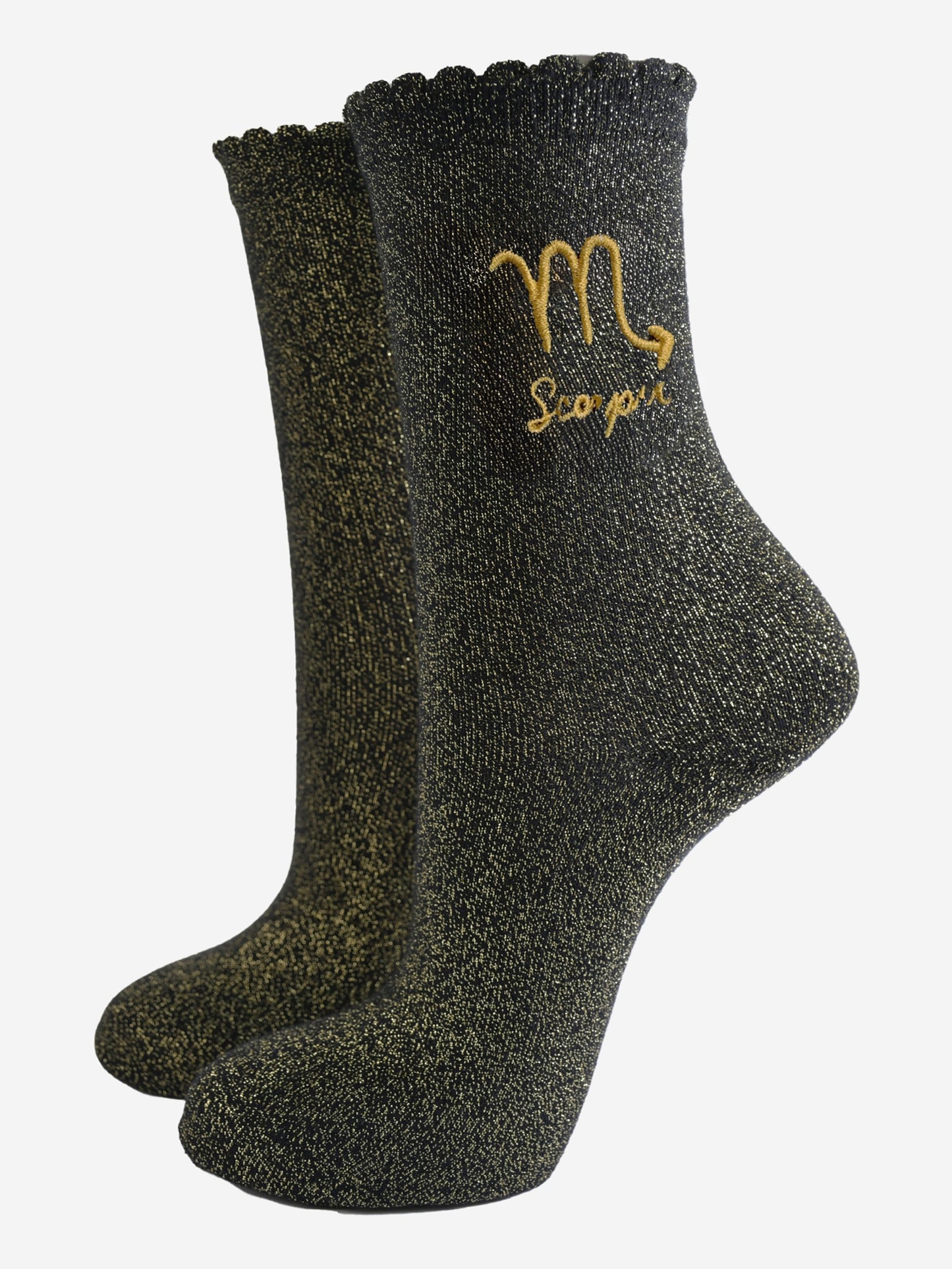 black and gold sparkly ankle socks with a scalloped cuff and an gold embroidered scorpio zodiac symbol and name