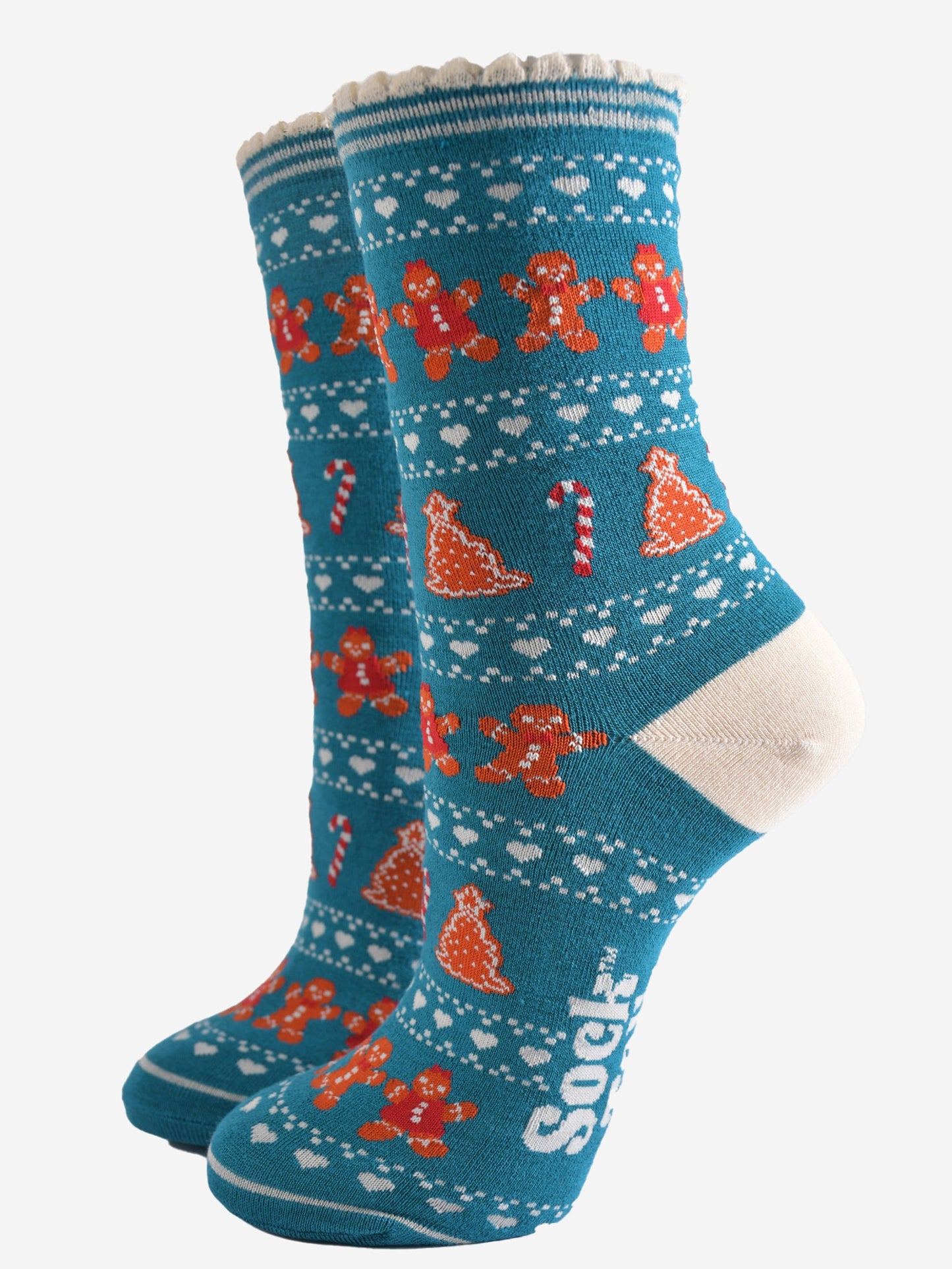 teal blue bamboo socks with a fair isle style pattern featuring candy canes, gingerbread cookies and love hearts