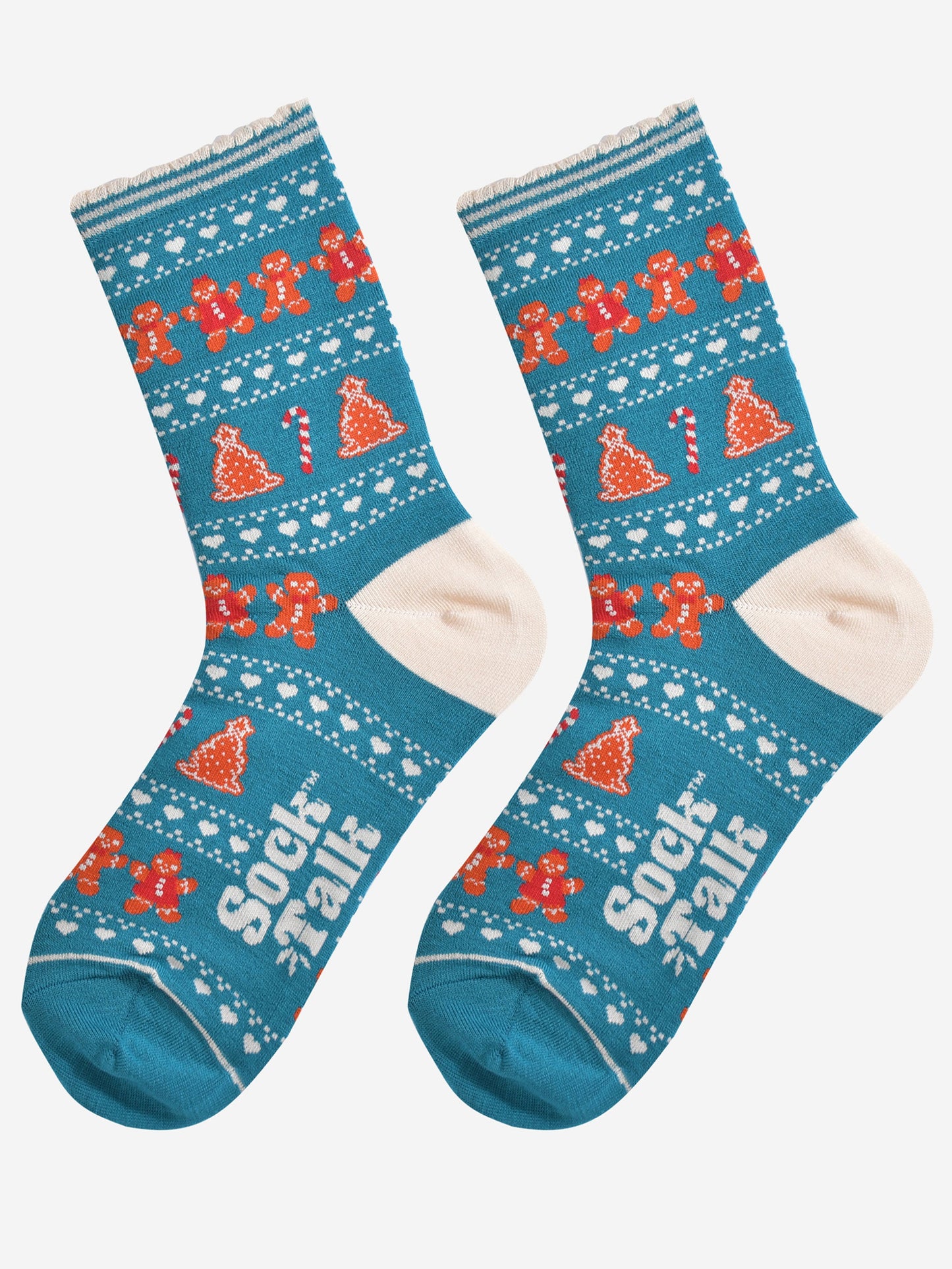 showing the festive gingerbread socks laying flat, the fair isle pattern is all over the socks and features gingerbread men, gingerbread women, gingerbread xmas tree cookies, candy canes and love hearts
