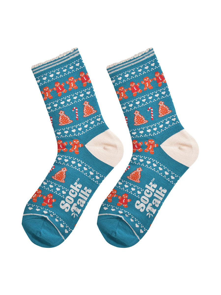showing the festive gingerbread socks laying flat, the fair isle pattern is all over the socks and features gingerbread men, gingerbread women, gingerbread xmas tree cookies, candy canes and love hearts