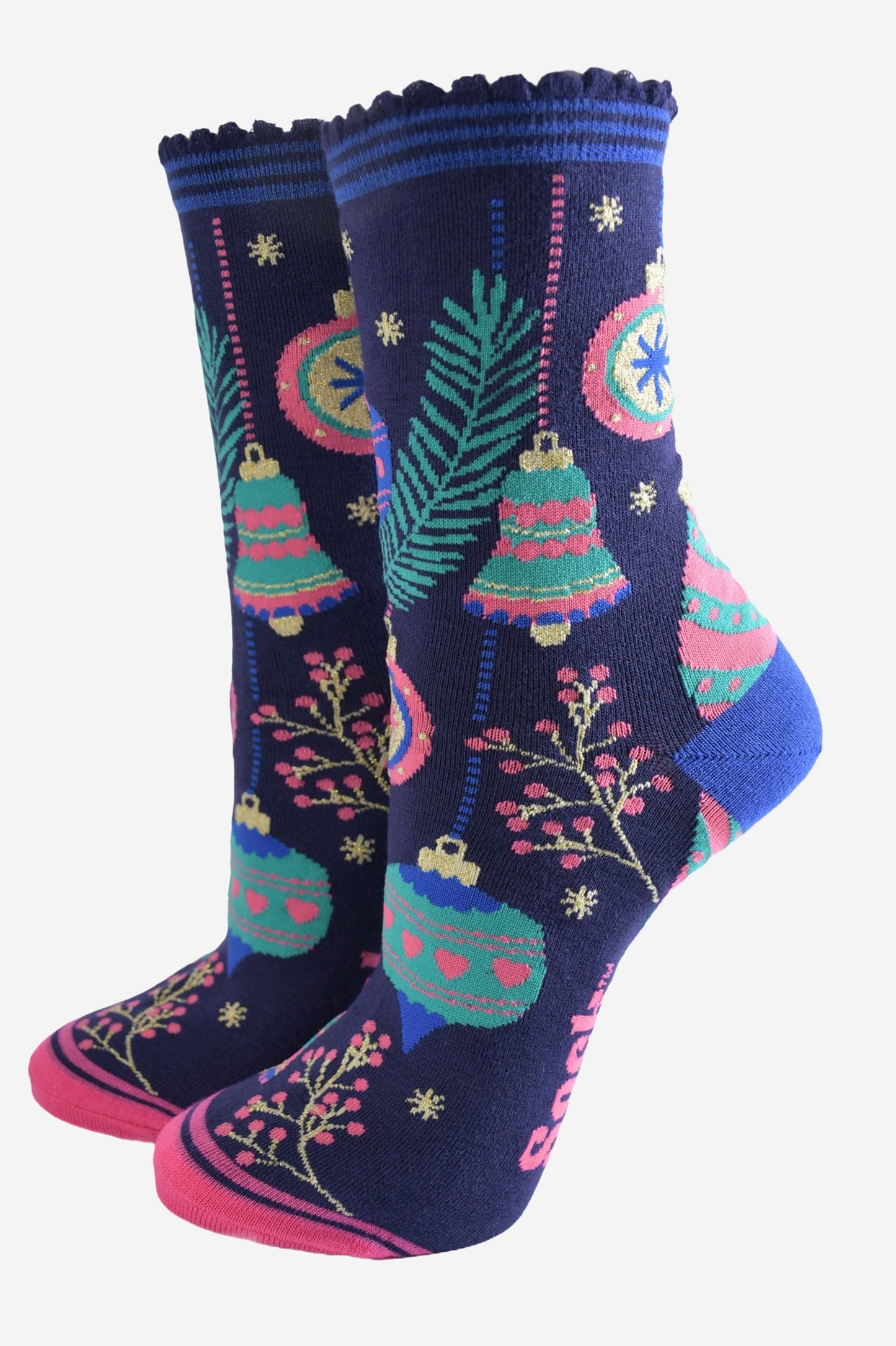 navy blue socks with colourful christmas tree baubles and bells, pink berries and gold starbursts.